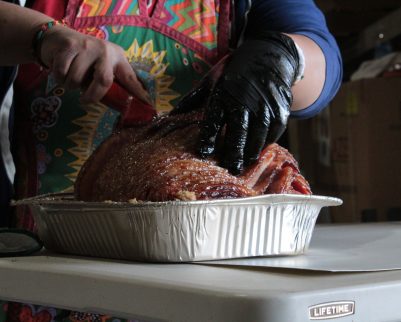 smoked ham being sliced