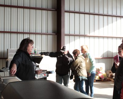 sheryl and tony valentine teaching about the grills at outdoor chef
