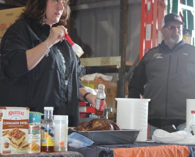 sheryl and tony valentine teaching smoked turkey techniques at outdoor chef