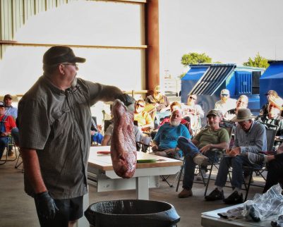 Tony Valentine prepping a brisket for a live cooking class as Outdoor Chef